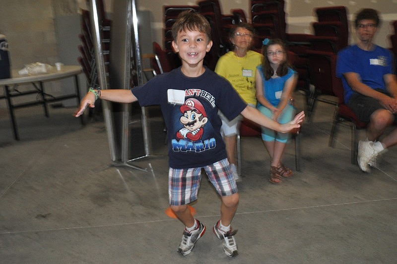 Giancarlo Cintron, 8, did a little dance as he scooted by untagged during a game.