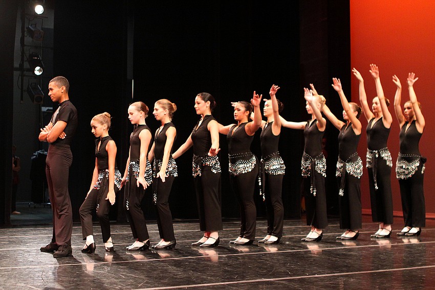 The girls line up behind fellow student Yamil Maldonado to create an interesting optical illusion during one of their dances Saturday, Aug. 13, at the FSU Center for the Performing Arts.