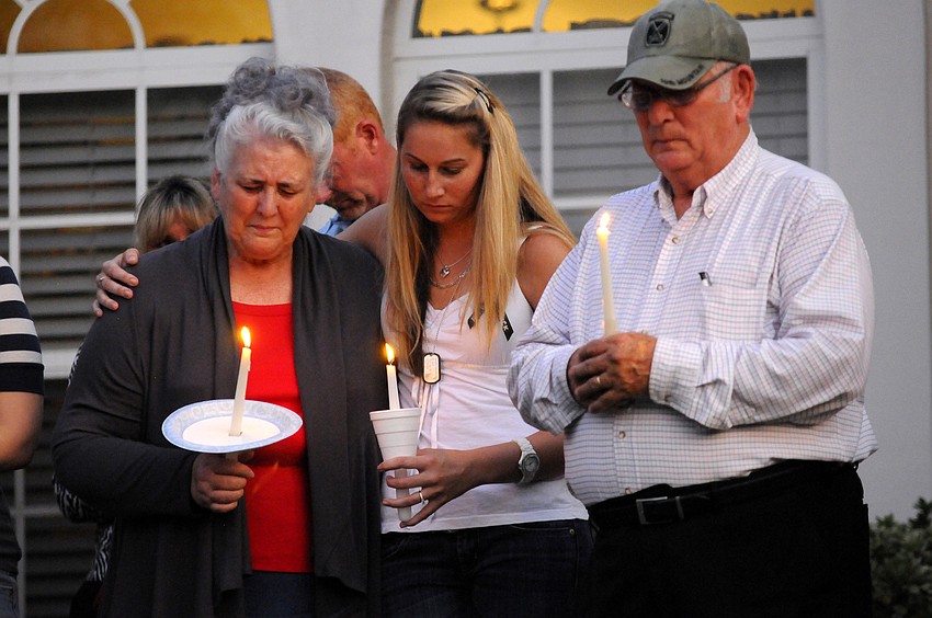 U.S. Army Spc. 4 Patrick Lay II's fiance, Joann Steiff, center, grieves with Lay's grandparents Carolyn and Ben Eason.
