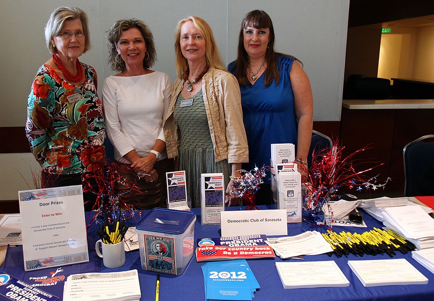 Pat Coville, Nancy Feehan, JoAnne DeVries and Mary Clupper pose at the Democratic Club of Sarasota display table.