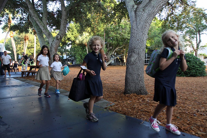 Students make their way to their classrooms on the first day back to school Wednesday, Aug. 24 at Out-of-Door Academy.