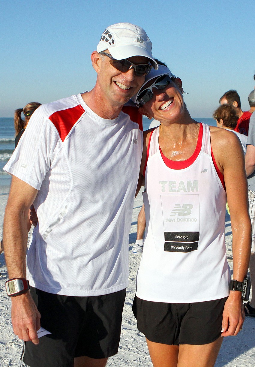 Tom and Rachel Chambers smile big on Saturday, April 2 after completing the 25th Annual Run for the Turtles on Siesta Key Beach.
