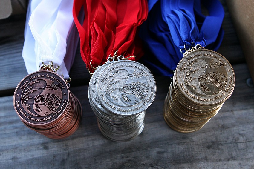 The medals given out to the first, second and third place were stacked on a table on Saturday, April 2 during the 25th Annual Run for the Turtles on Siesta Key Beach.