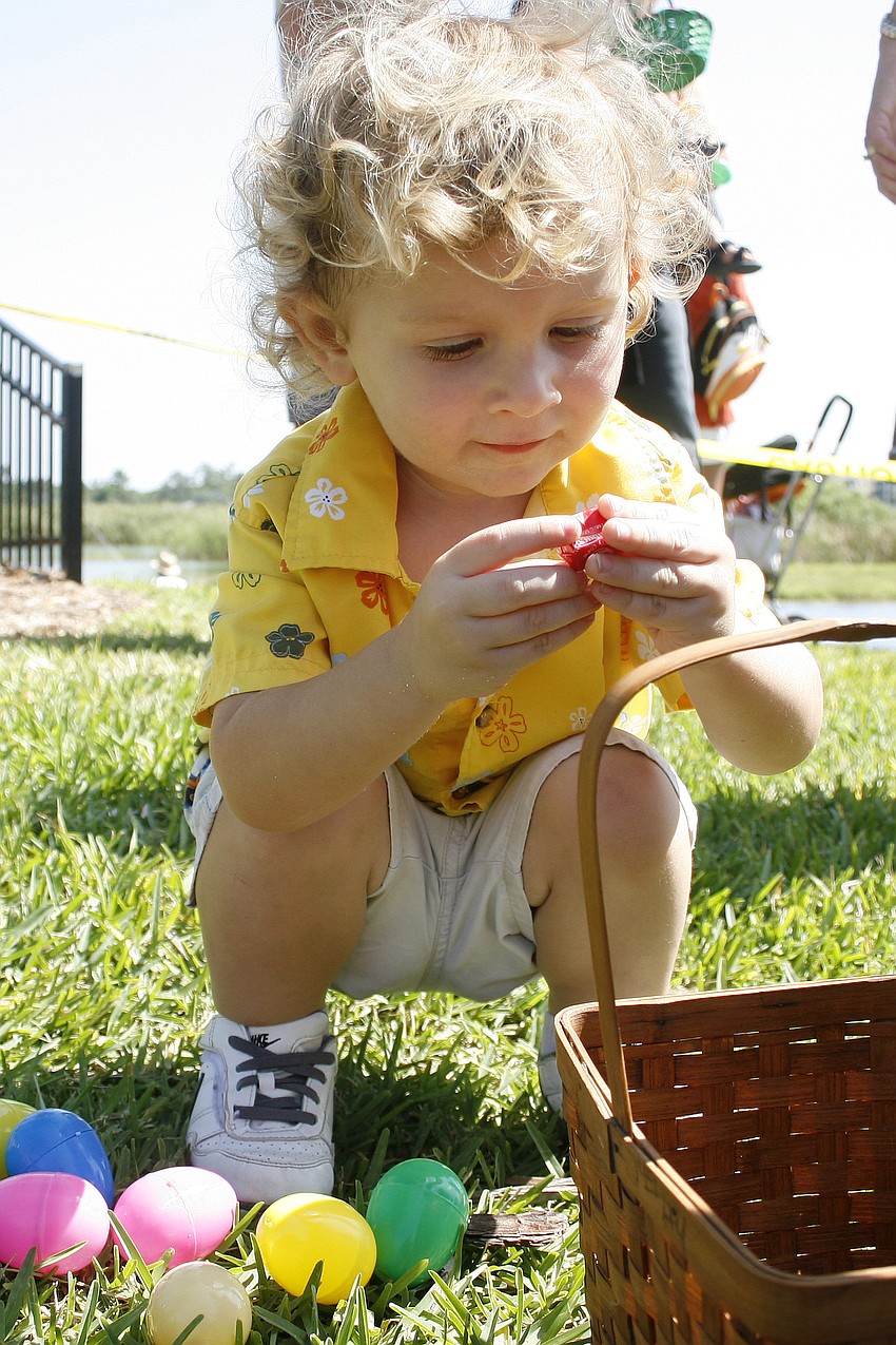 Kai Bunker, 2, surveyed his haul with his dad.