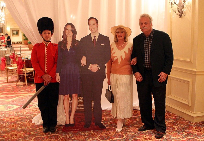 Michelle and Robert Slider pose with the royal wedding couple and guard, Chris Starman on Friday, April 29 at the Ritz Carlton.
