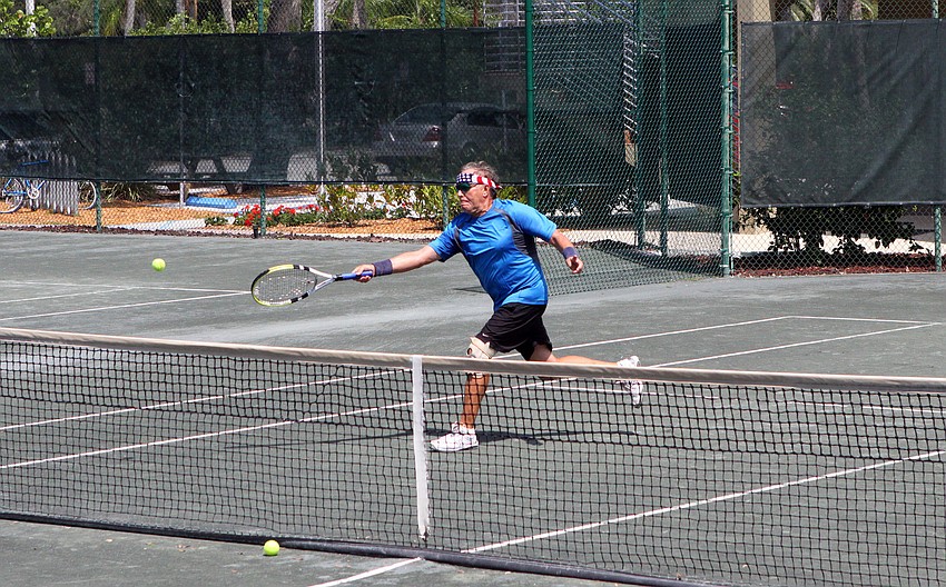 John Beeman goes for the ball Wednesday, April 27 during the Longboat Key Tennis Center's 2011 Spring League championships.