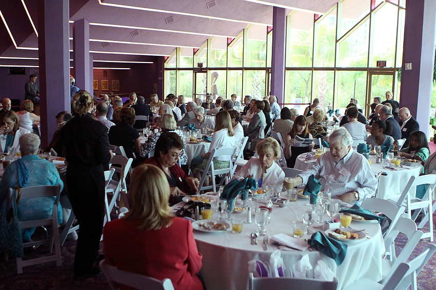 People attending the 10th Annual Education Celebration enjoy eating breakfast Friday, April 29 at Van Wezel Performing Arts Hall.