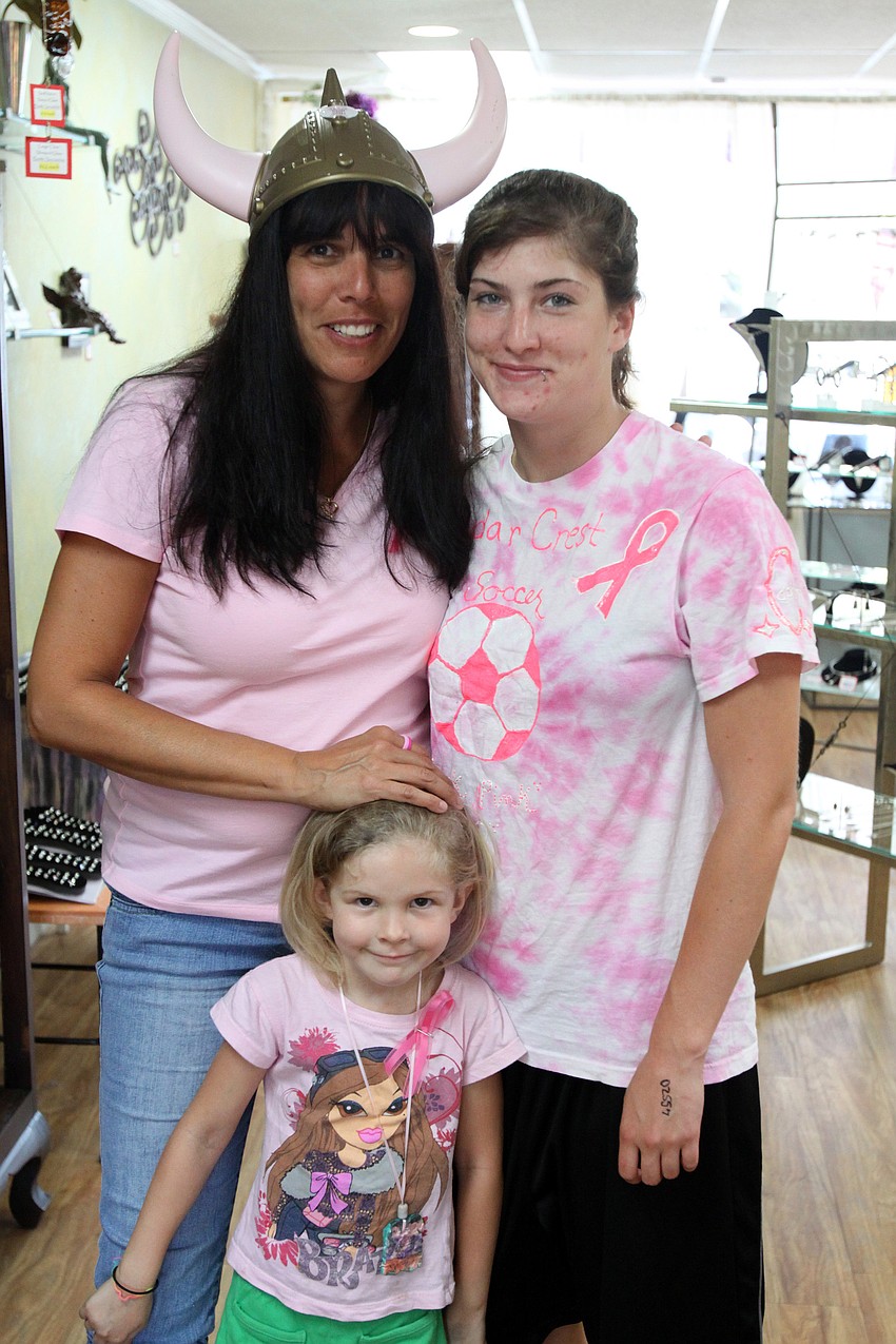 Karla Smith with her daughter Samantha Smith and her granddaughter Alexis Campbell inside Silver Obsession prior to going out for Pillage the Village fundraising event Friday, May 6 at various locations throughout Southside Village.