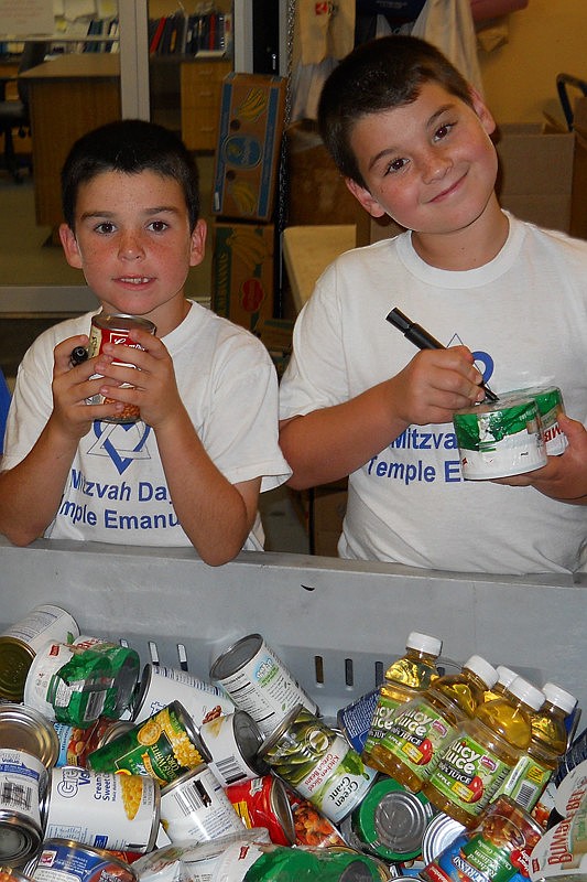 Aiden Pearson and Cooper Zion of East County sort food at the food bank during Temple Emanu-El's Mitzvah Day.