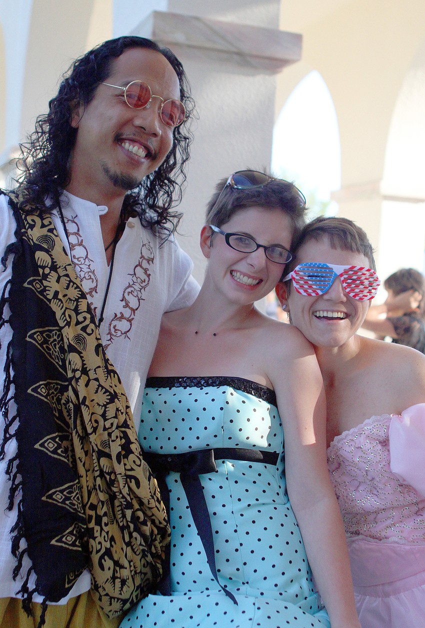 Alberto Fenix, Christina Lawrence and Brittney Champagne dressed up in fun outfits for their commencement ceremony Friday, May 20 at College Hall Bay Front.
