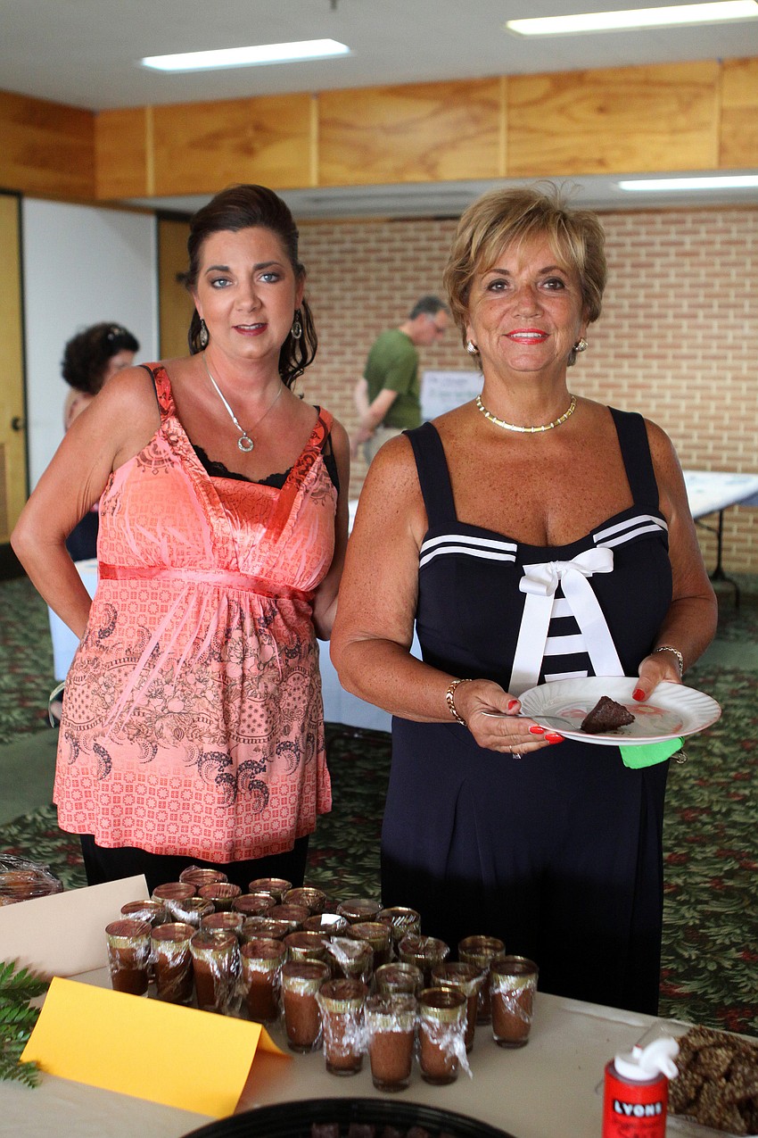 Debra Nespor and Cheryl Nespor get ready to try some of the desserts donated by 29 different donors for Family Promises' Third Annual Just Desserts event Friday, May 20 at Selby Garden's Great Room by the Bay.