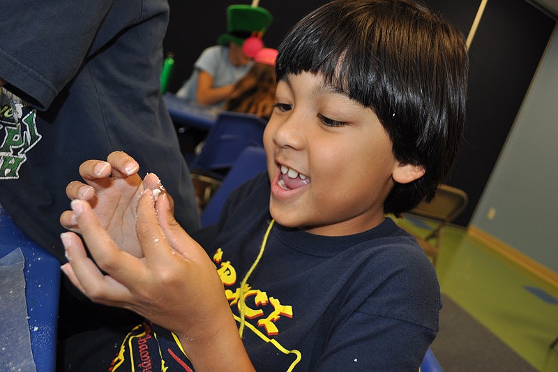 Enzo Dihn, 6, added granules to the soap concoction he and teammates were making.