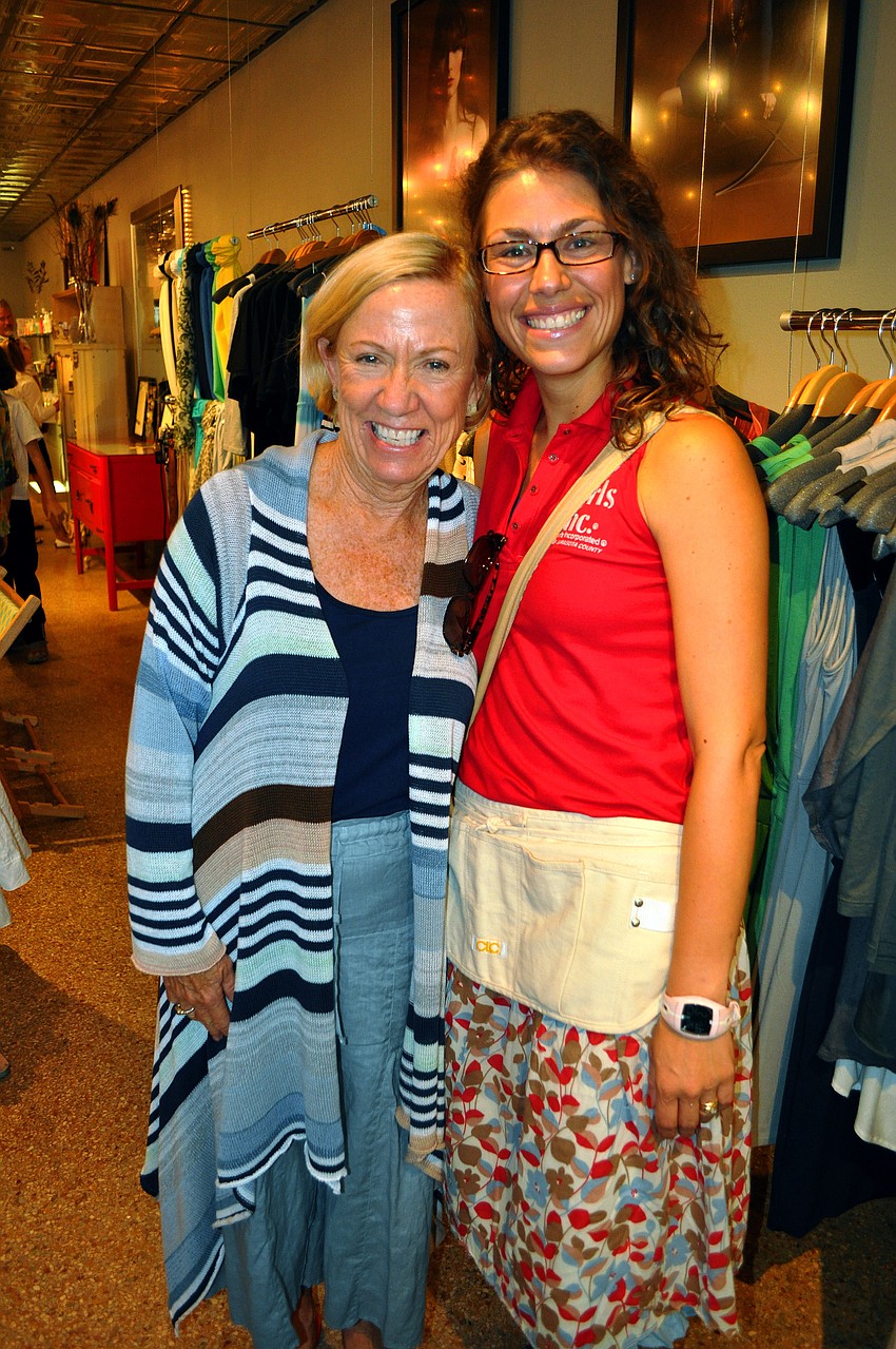 Sue Schell poses with Marisa Monroe Saturday, June 25 inside Lotus.