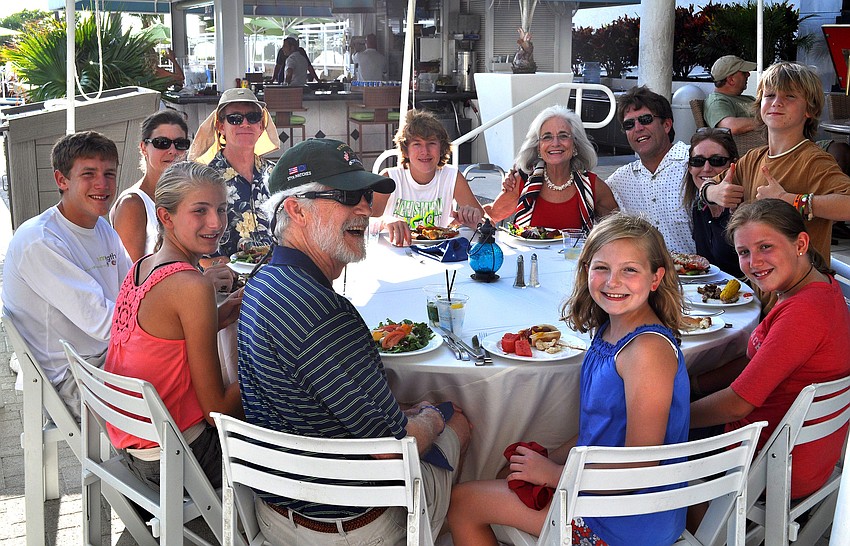 Graci and Dennis McGillicuddy's family celebrate the holiday weekend and Graci's recent clean bill of health from the Moffitt Cancer Center Sunday, July 3 at the Lobster BBQ by the pool at Longboat Key Club Resort.