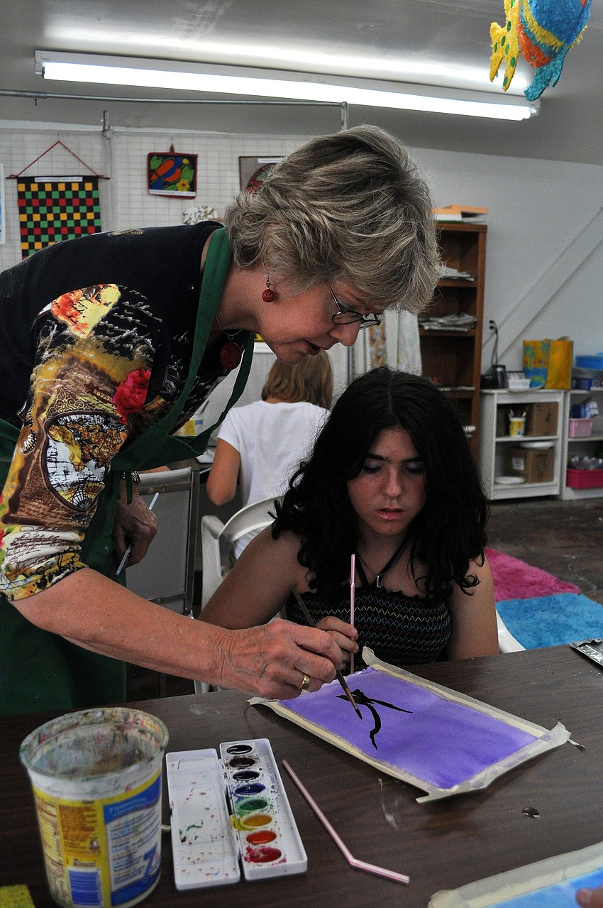 Charlotte Smith gives some guidance to Leandra Ellerin, 13, Friday, July 8 at the Art and Photography Studio of Colleen Cassidy.