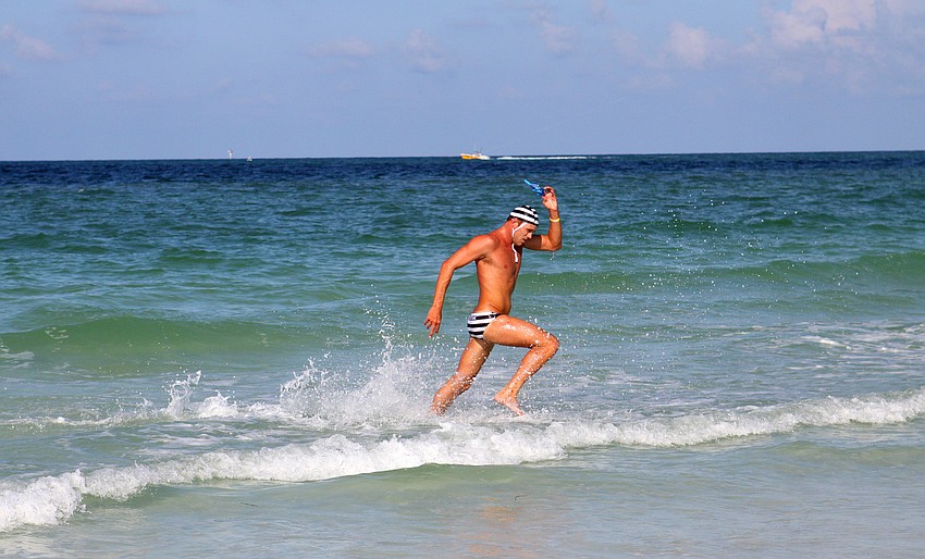 Destin lifeguard Dylan Newbiggin came in first in the menâ€™s surf swim event Thursday, July 14 during the 2011 James 