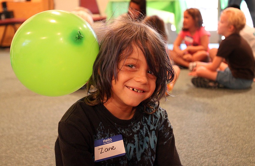 Zane Comingore, 9, got a balloon stuck to his head due to static electricity.