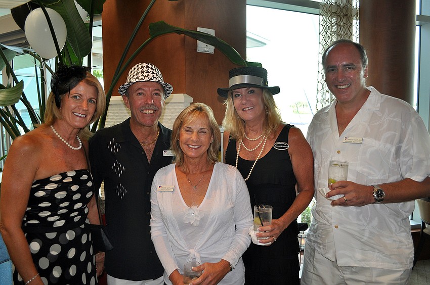 Laura Proctor, Mike and Diana Brown, Jeanne and Gerard Ezcurra pose together at the SYC Black & White Ball Saturday, August 13 at the Sarasota Yacht Club.