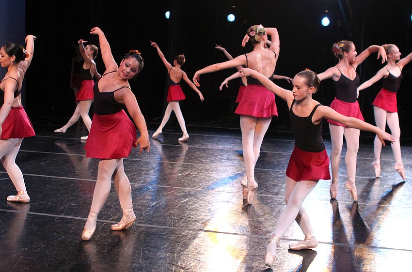 The students dance across the stage during the opening number.