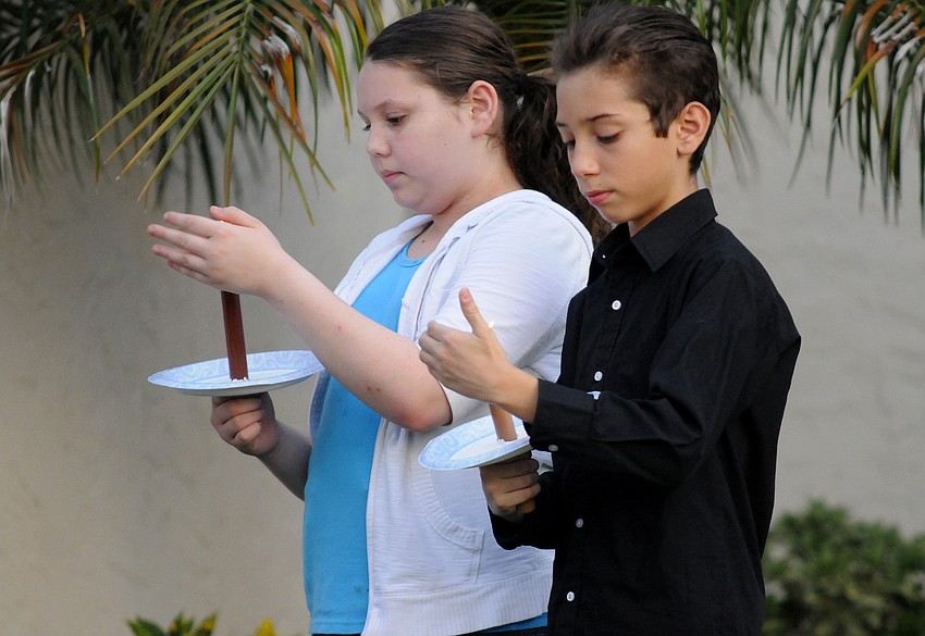 More than 200 mourners of all ages offered their condolences to the family of U.S. Army Spc. 4 Patrick Lay II during a candlelight vigil Aug. 15.
