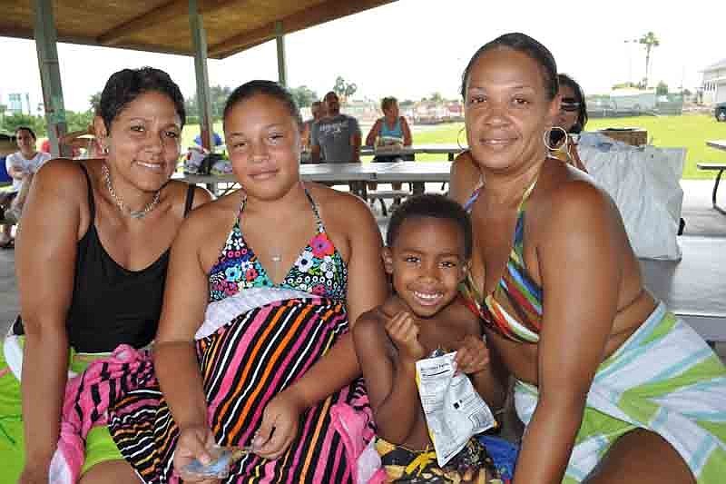 Christine Proctor and her daughter, Cydnie, and their friends, Demetrius and Stephany Shaw, relaxed in the shade.