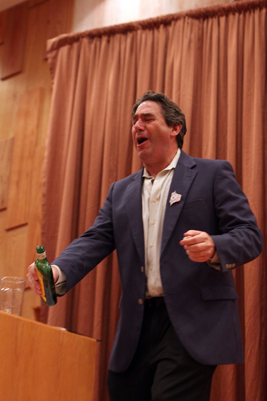 Rabbi Katz makes a joke about Purim being known as a drinking holiday on Saturday, March 19 at Temple Beth Israel.