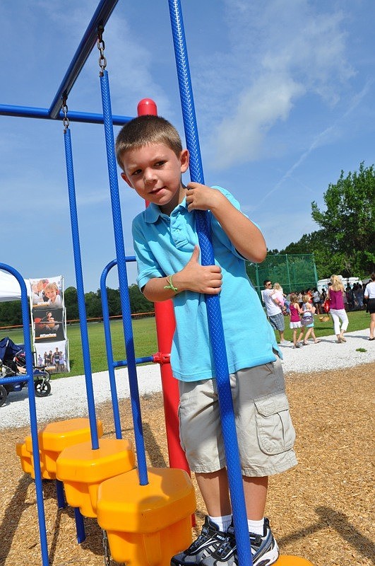 Kyle Honaker, 5, made his way carefully across the playground equipment.