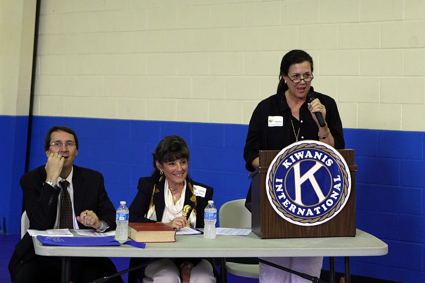 Jacki Boedecker reads the word to one of the spellers while Kraig Koach and Dorothy Stuart wait to hear the correct spelling at the Sarasota Kiwanis Club's Spelling Bee Friday, May 13 at the Boys and Girls Club.