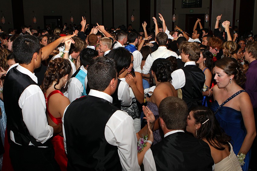 Students enjoy dancing on the dance floor with their dates and friends Saturday, May 14 at the Sarasota High School's prom at the Hyatt Regency.