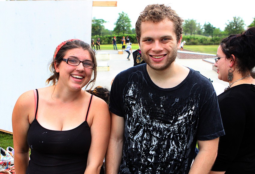 Eva Gray and Christopher Lay have fun together Saturday, May 14 during the Golden Era Tour event at Payne Park's skate park.