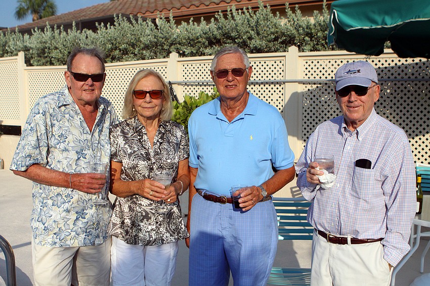 Fred and Vivian Leahy pose with Bernard Levine and Kip Cohen at Harbour Circle's End of Season BBQ Sunday, May 22 at the pool.