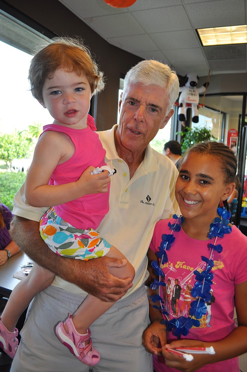 John Myers, center, enjoyed the evening with his granddaughters, Caroline, left, and Alexa, right.