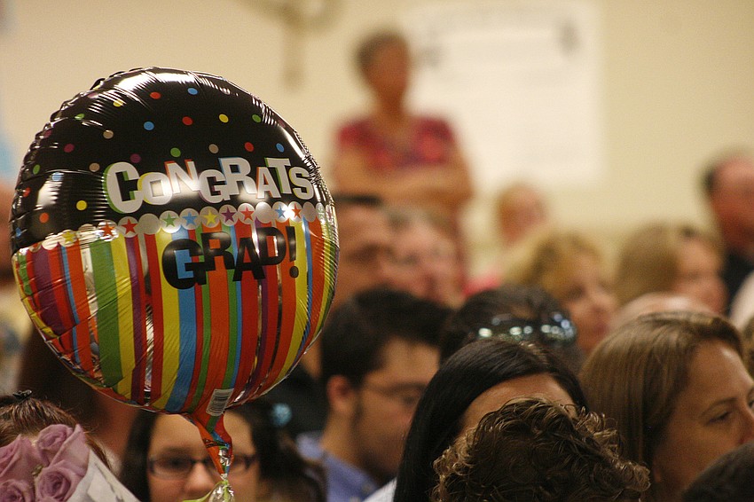 Family members brought balloons and flowers to congratulate their graduates.