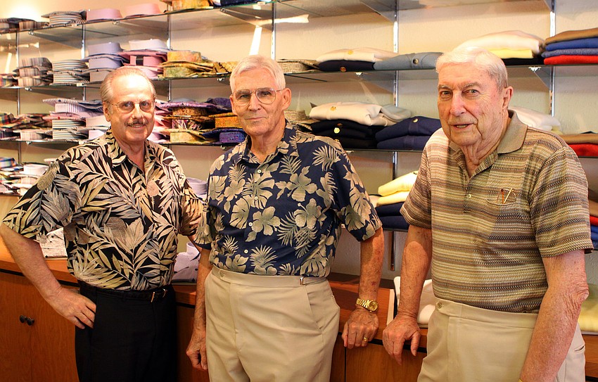Don Povec, Paul Myres and Richard Newcomer pose together Friday, June 3 during Taffy's grand opening at his new store front on St. Armands.
