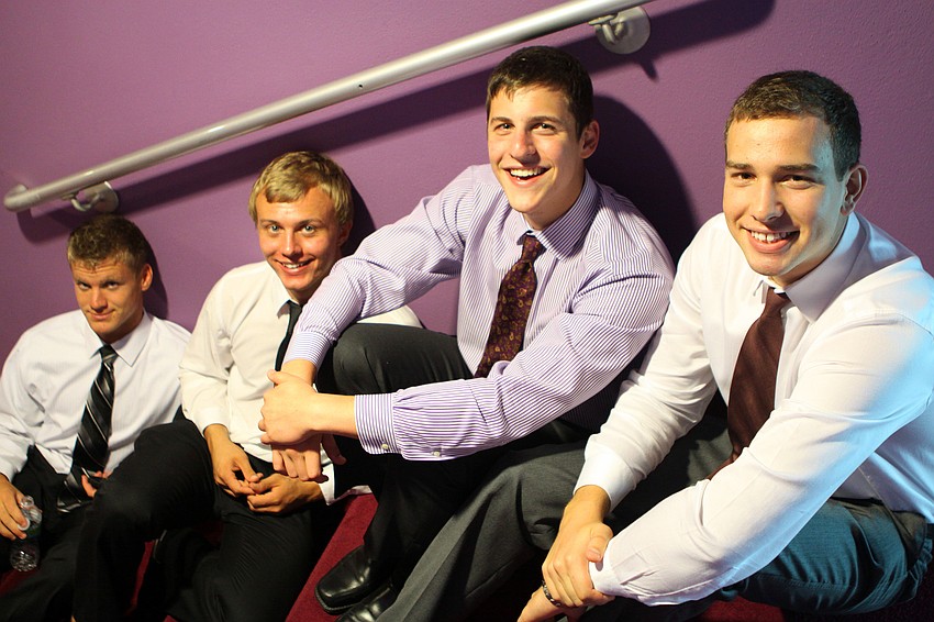 Kirt Davis, Jan Frankowski, Nikolas Soulandros and Oscar Lind hang out on some steps prior to having to get ready for their graduation ceremony Sunday, June 5 at Van Wezel.