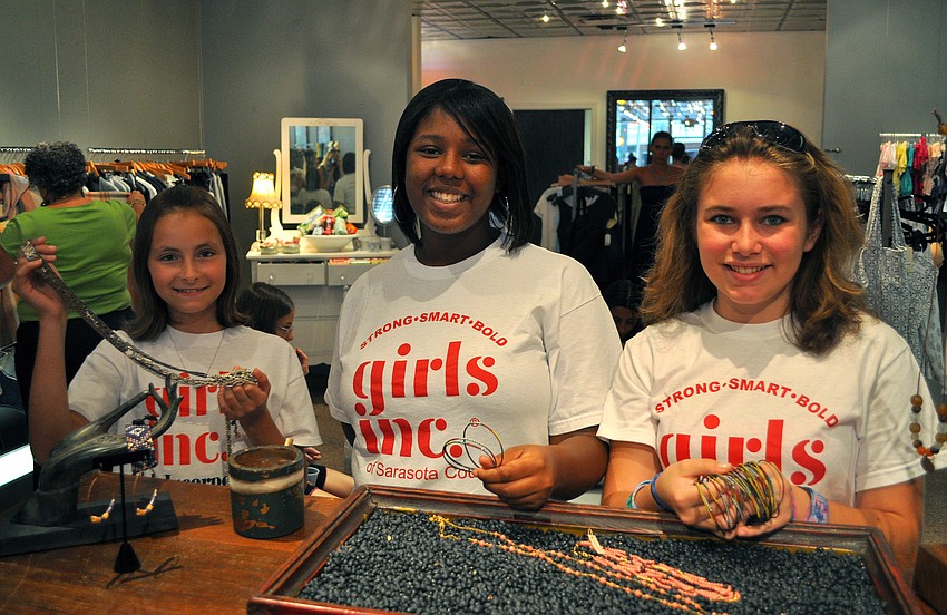 Taylor DeStasio, 13, Tyesha Brown, 14, and Jaime Weill, 13, show off some of the jewelry they liked Saturday, June 25 at Lotus.