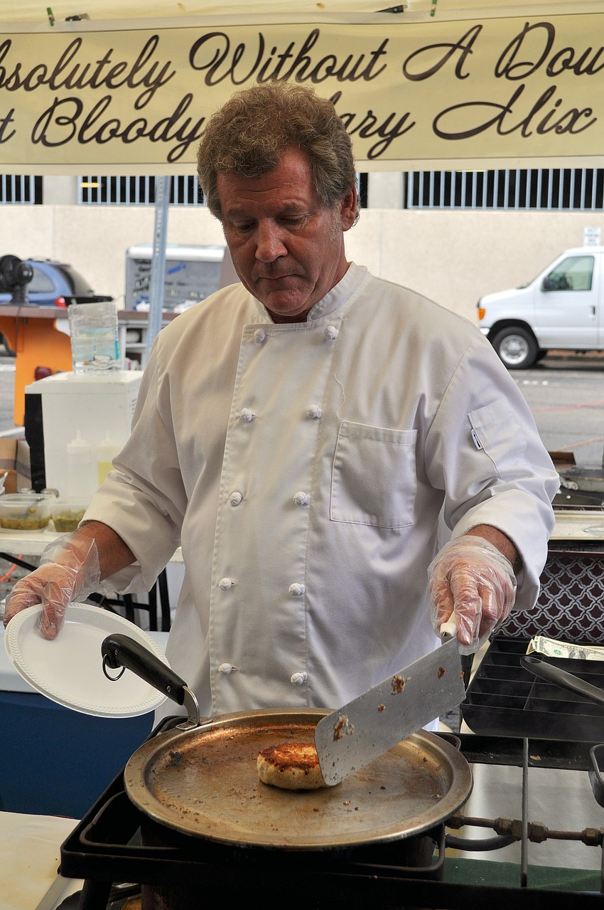 Chef James Besterre, of Annalida's, works on frying up the lump crabmeat for a crab cake sandwich Saturday, July 2 during the Sarasota Farmers Market first ever Shrimp and Lobster Festival.