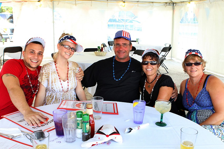 Lyle Smith, Jenna Smith, Jeff Smith, Debbie Smith and Wicki Wentzell enjoy themselves Saturday, July 2 at Moore's Stone Crab.