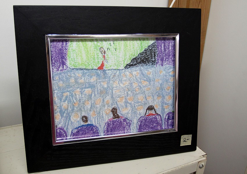 A drawing of someone performing on stage to a packed house was undated and did not have any name or signature on it.