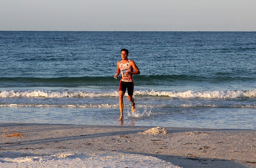 Thomas Barton was the first person to complete the swimming portion of the Siesta Key Triathlon Saturday, July 23 out at Siesta Key Public Beach. Barton had about a three-minute lead over the rest of his competitors.
