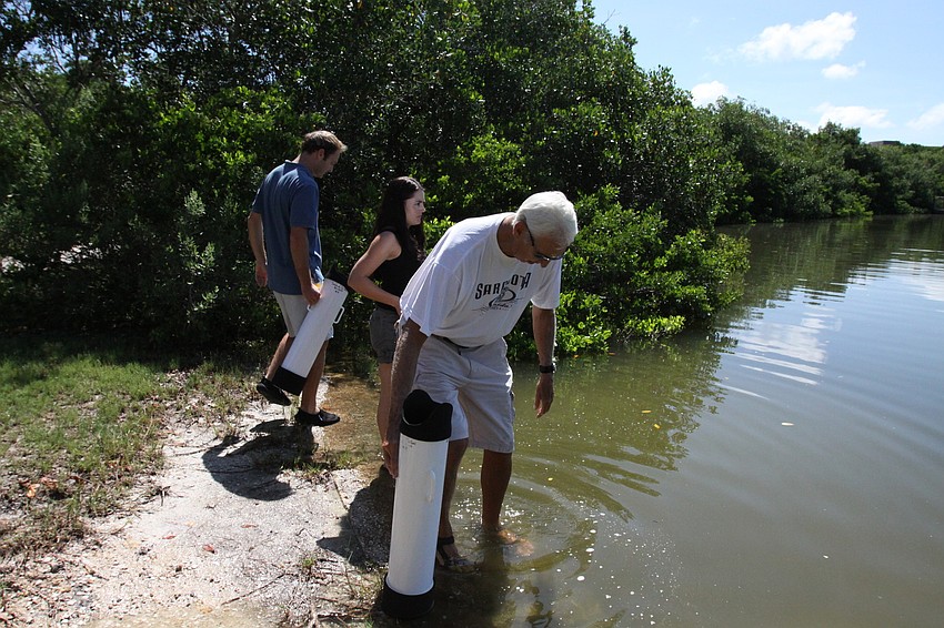 Chris Wetzig, Amanda Dominguez and Bob Clousson make their way into the water to try out the Aqua-Scopes and do a mini lesson Saturday, July 30 out in the water by the Turtle Beach Community Center