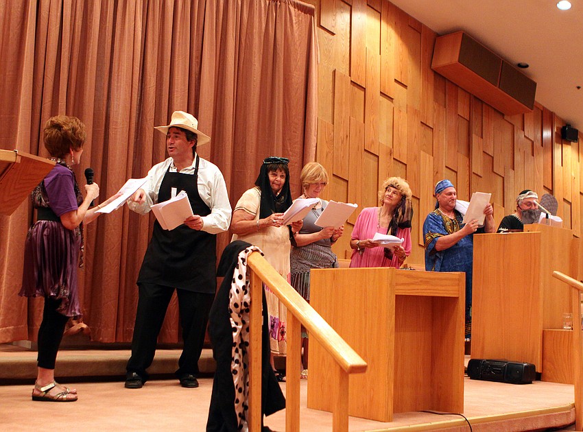 Rabbi Katz talks to Judy Goldstein during the Purim play on Saturday, March 19 at Temple Beth Israel.