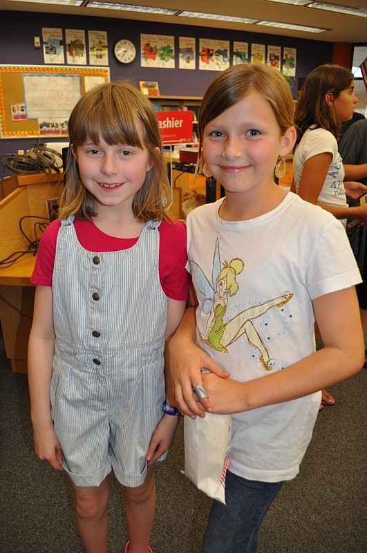 Rachel Macmillan and Kaylie Adams checked out the book fair with their older sisters.