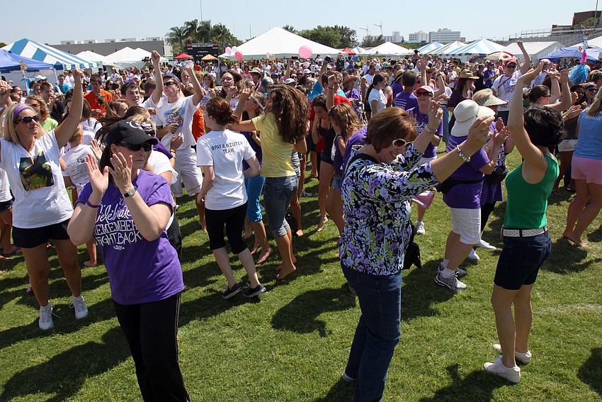 Survivors and supporters dance around to Katy Perry's 
