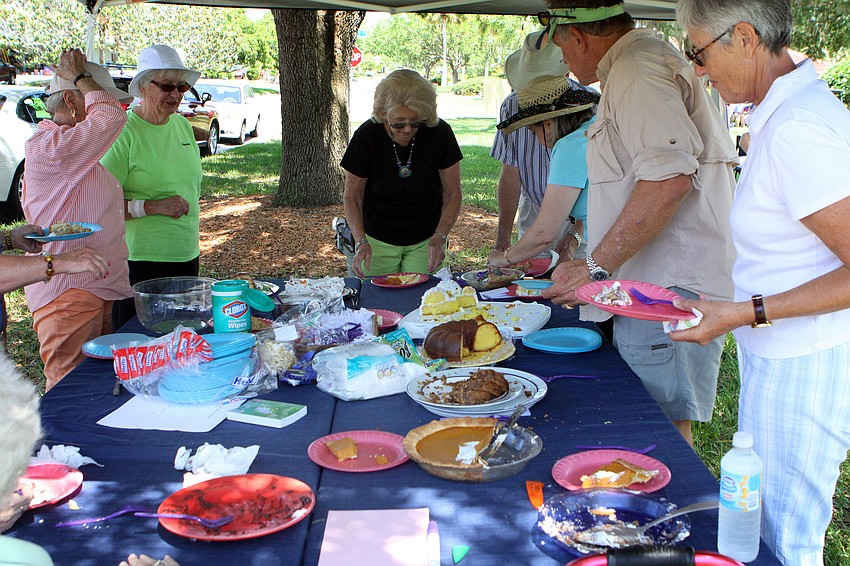 People enjoy some of the cakes and pie made by people who submitted entries into the South Bay Women's Club Pie or Cake Contest on Sunday, April 17 during South Bay's Family Fun Day.