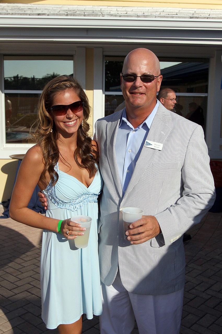 Amanda Brooks poses with her father, Mayson, Saturday, May 7 during the after party for the Sarasota Bay Cup at Bird Key Yacht Club.