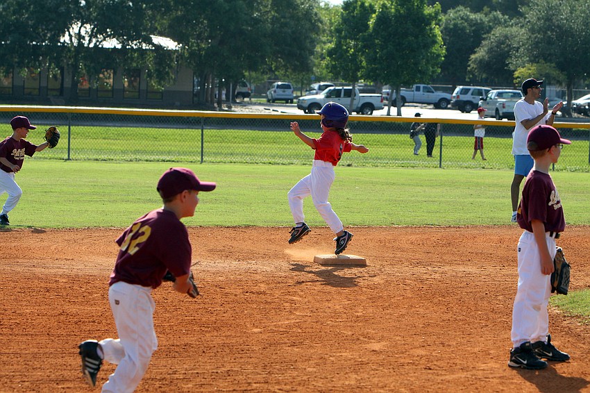 Annabelle Weber makes it safely to second base during their final game of the Spring season Monday, May 9 at Twin Lakes Park.