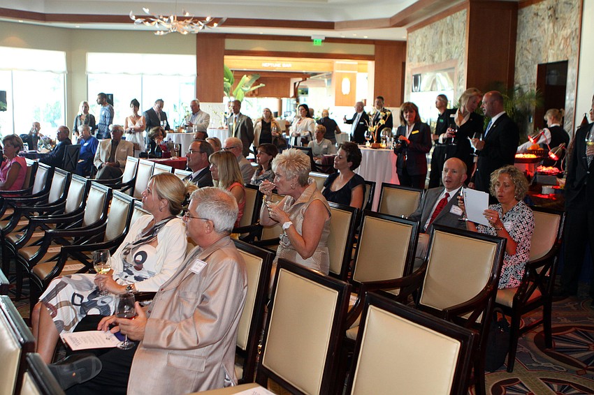 People listen to the presentation given by Jane Vermeulen, Travel Director at Travcoa, Tuesday, May 17 during the 