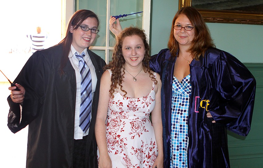 Marie Van Camp, Katie Klein and Sarah Gregory pose together inside College Hall prior to their commencement ceremony Friday, May 20 at College Hall Bay Front.