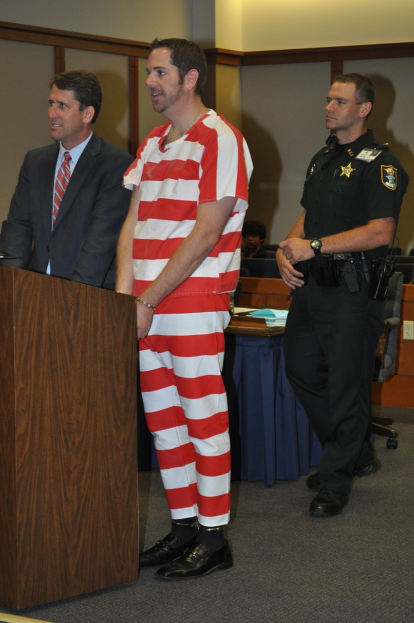Acting as Sean McDonald's attorney, Morgan Bentley stifles a laugh as Judge Thomas Krug rules that he is to complete report cards for Kelly Rose's students. Lt. Joseph Guttman stands by.
